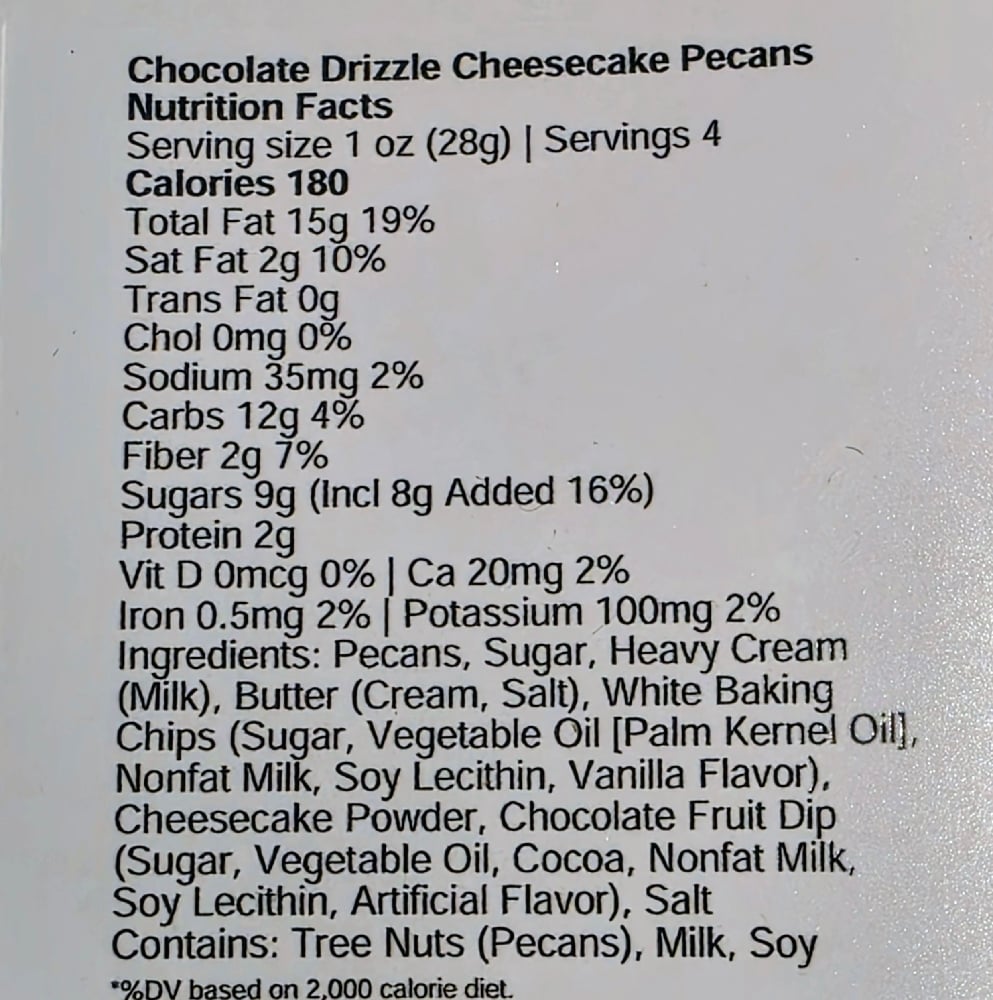 Chocolate drizzled cheesecake pecans